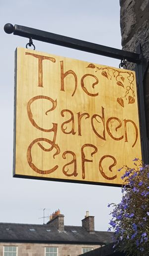 Our lovely handmade cafe sign courtesy of Zoe Baker. at The Garden Cafe and Takeaway in Kendal