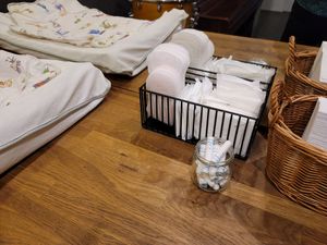 Feminine products in bathroom at Ka Vegan Udon & Sushi in Krakow