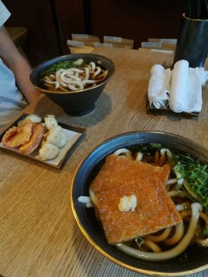 Udon with tempura, the other with sweet tofu skin at Ka Vegan Udon & Sushi in Krakow