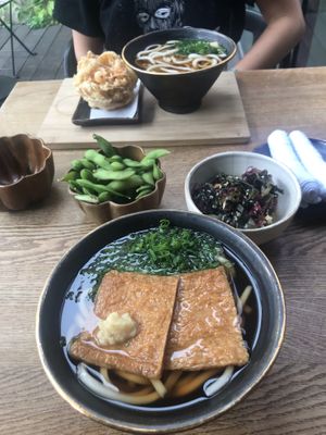 Warm Udon noodles with additional sides  at Ka Vegan Udon & Sushi in Krakow