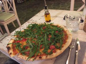 Vegan Pizza with Cherry Tomatos and Rocket Salad at The Seed in Mallorca