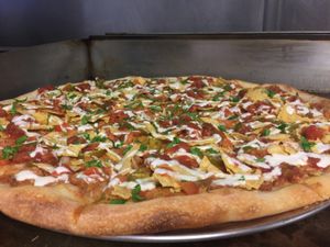 Loaded Nacho

Refried beans, Tomato, Onion, Jalapeño, Nacho Chips, Salsa Picante, Vegan Sour Cream, Fresh Cilantro at Mora Pizza in Miami