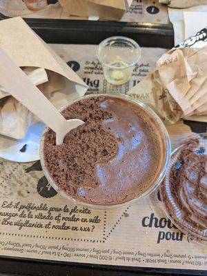 Mousse au chocolat, doesn't look that nice in that plastic container, but it is yummy anyways! at Hank Cuisine Végétale - Rochechouart in Paris