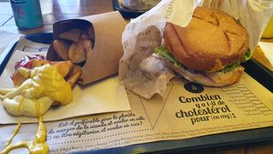 Ronald burger with potato wedges. at Hank Cuisine Végétale - Rochechouart in Paris