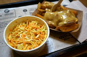 Potato Wedges w/cheese fondue + Coleslaw at Hank Cuisine Végétale - Rochechouart in Paris