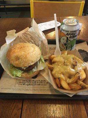 Sgt pepper burger, cheesy fries and a drink  at Hank Cuisine Végétale - Rochechouart in Paris