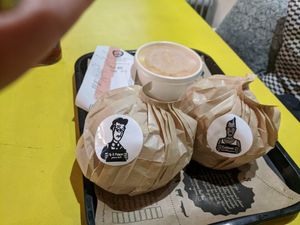 Two burgers and coleslaw. at Hank Cuisine Végétale - Rochechouart in Paris