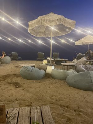 Outdoor seating on the beach.  at Genius Cafe in Sanur