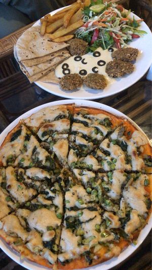 Vegan cheese pizza and Israeli plate  at Pumpernickel Bakery and Babylon Cafe in Pokhara