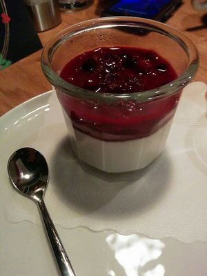 Coconut panna cotta with forest fruit.

Photo by: Predatoria M. on Facebook at Uno Rajh in Murska Sobota