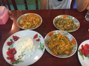 Pumpkin curry, tofu vegetable curry, aubergine dip and papadam bread at Marie Min in Mandalay