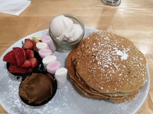 Vegan pancakes with marshmallows, biscoff, ice cream, strawberries at Causeway Cafe in Belfast