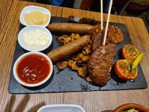 Mixed grill plater and sauces at Vegetus in Cheltenham
