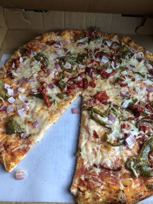 CYO pizza with vegan cheese, peppers and onions at Veggie Crust in Brookline