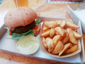Forest burger with potato wedges and curry dipping sauce at Las Vegan's - Vegan Garden Trailer in Budapest