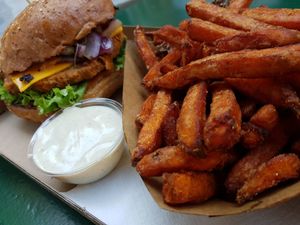 Seitan burger with sweet potato fries and garlic veganase   at Las Vegan's - Vegan Garden Trailer in Budapest
