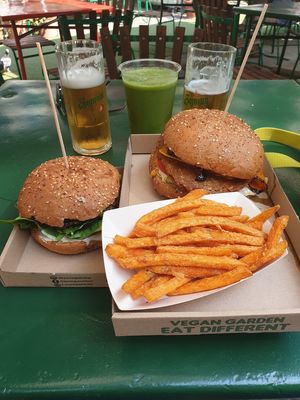Cheezy seitan burger, mushroom burger and sweet potato fries. at Las Vegan's - Vegan Garden Trailer in Budapest