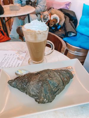 Croissant and coffee with cream at Dolce & Vegana in Madrid