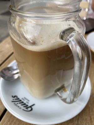 Oat milk large coffee  at Dolce & Vegana in Madrid