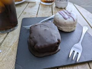 Black phoskito (Spanish thing that dunks a genovese cake slice in chocolate) at Dolce & Vegana in Madrid