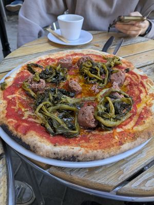 Neapolitan pizza with sausage and broccoli greens at Dolce & Vegana in Madrid