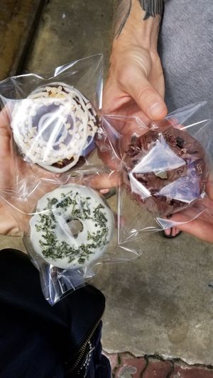 We got some donuts to go. They have a strong coconut taste! at The Raw by Twins in Seoul