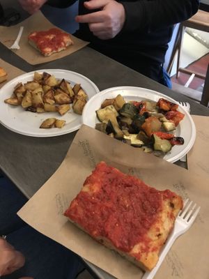Tomato focaccia . Roast potatoes and roasted veg . All delicious  at Trieste Pizza in Rome