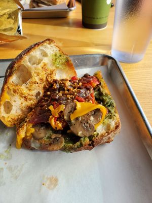 Vegan artichoke sandwich plenty of goodies inside with vegan cheese at Lemon Tree in Boise