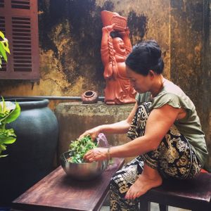 Mom is preparing food.  at Mama Vegetarian Cafe in Hoi An