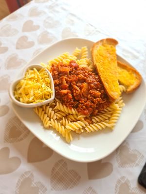 Pasta Bolognese with homemade garlic bread at The Vegan Rocket in Lisburn