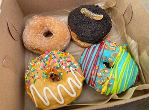 Cinnamon Sugar is a regular bakery item. Dirt ’n Wormz, Queersicle and Superman are seasonal specials.   at Strange Matter Coffee - Downtown in Lansing