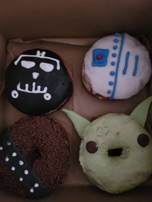 "May the Fourth" box: R2D2
Lemon glaze filled with house-made strawberry jam.
Chewbacca
Chocolate glaze, chocolate sprinkle!
Baby Yoda
Matcha glaze with tasty white chocolate ears. at Strange Matter Coffee - Eastside in Lansing