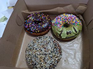 Chocolate sprinkles, matcha frog, savory vegan everything donut at Strange Matter Coffee - Eastside in Lansing