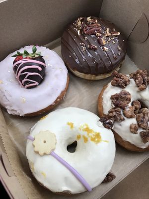A box I got around Valentine’s Day. My favorite one was the cream filled chocolate turtle donut and my boyfriend loved the Earl grey flavor.   at Strange Matter Coffee - Eastside in Lansing