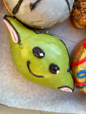 Star Wars Day release. Green Tea Grogu. Matcha glazed exterior with jasmine green tea jelly filling.  at Strange Matter Coffee - Eastside in Lansing