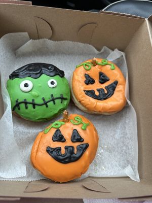 Love the filled donuts! Halloween themed jack o lantern filled with blood 🩸 orange 🍊 jelly and Frankenstein filled with apple 🍏 pie filling…. So good!!!  at Strange Matter Coffee - Eastside in Lansing