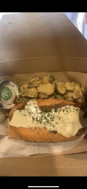 Vegan chili cheese dog with fried pickles and curly fries (in separate box)  at The Dogfather in San Antonio