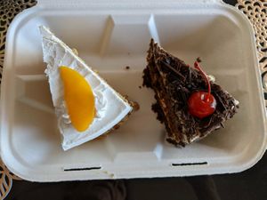 Vegan vanilla and peach cake, and black forest cake. Sooo good. at Donde Gopal in Quito