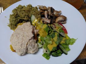 Pesto-Quinia, vegan cheese on fired banana, champignons, salad at Donde Gopal in Quito