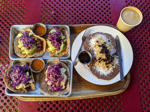 Lucky squash tacos and electrified berry pancakes, latte with agave. at ATX Food Co in Austin