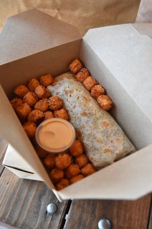 Breakfast Burrito with sweet potato tots at Vida Eatery  in Bakersfield