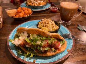 Native taco with mac’n’cheese, Mexican chocolate, sweet potato tots, garlic aioli fries (background)  at Vida Eatery  in Bakersfield