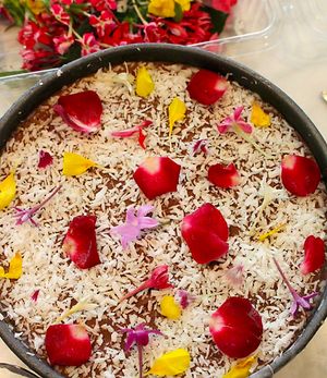 Postre crudivegano con cacao crudo, dátiles, coco, flores comestibles. at The Vegan - Pop Up in La Coruna