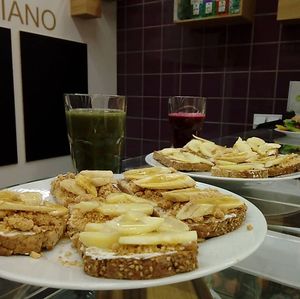 Healthy toastie with peanut butter or creamcheese, apple, honey and coconut or nuts.  at Natura Bolhao in Porto