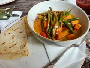Vegan roti with sweet potato, veggies, coconut green beans, and roti pancake at Het Ruiterhuys in Castricum