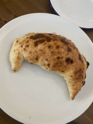 Vegan caltzone with artichoke and onion  at HaPizza in Tel Aviv