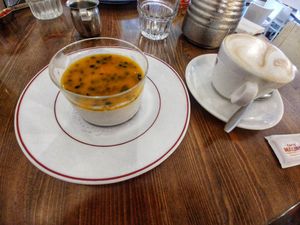 Vegan panna cotta with passion fruit & mango and cappuccino on soy at HaPizza in Tel Aviv