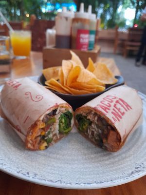 Vegan burrito with chips at Tacos La Neta in Panama City