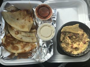 Chili-Lime Tofu w/cheese, grilled jalapeños, and onions quesadilla with a side of guacamole/chips.  at Archibowls in Lawrence