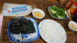 Veg-beed wrapped in herb and grilled, served with rice noodles, rice paper and sweet sour sauce at Tam An Lac - Dong Da District in Hanoi
